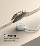 Apple Watch 9 / 8 / 7 (45mm) | Bezel Styling - Gold Apple Watch with protective bezel hovering over a wireless charger.