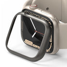 Apple Watch 9 / 8 / 7 (45mm) | Bezel Styling - A dark metallic bezel frame hovering above a beige Apple Watch.
