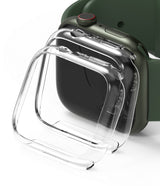 Apple Watch 9 / 8 / 7 (41mm) | Slim - Two clear, slim protective cases hovering in front of a green Apple Watch.