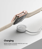 Apple Watch 9 / 8 / 7 (41mm) | Slim - Rose gold watch case on an Apple Watch hovering above a white wireless charger.