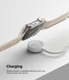 Apple Watch 9 / 8 / 7 (41mm) | Slim - Apple Watch with a clear protective case hovering above a wireless charging puck.