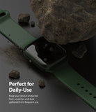 Apple Watch 9 / 8 / 7 (41mm) | Slim - Dark green watch case and band under a large rock on a black surface.