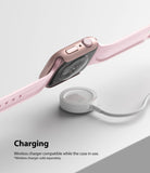 Apple Watch 9 / 8 / 7 (41mm) | Slim - Pink Apple Watch with slim case hovering above a white wireless charging puck.