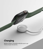 Apple Watch 9 / 8 / 7 (45mm) Case | Slim - Black slim case on an Apple Watch hovering above a wireless charging puck.