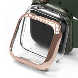 Apple Watch 9 / 8 / 7 (45mm) Case | Slim - Rose gold slim protective case hovering over a green Apple Watch.