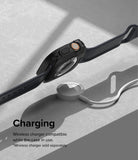 Apple Watch Ultra 3 / 2 / 1 Case | Air Sports - Black protective case on Apple Watch Ultra hovering above a wireless charger.