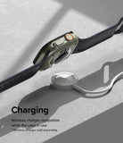 Apple Watch Ultra 3 / 2 / 1 | Glass + Bezel Styling Combo - Apple Watch Ultra with protective case hovering over a wireless charger.