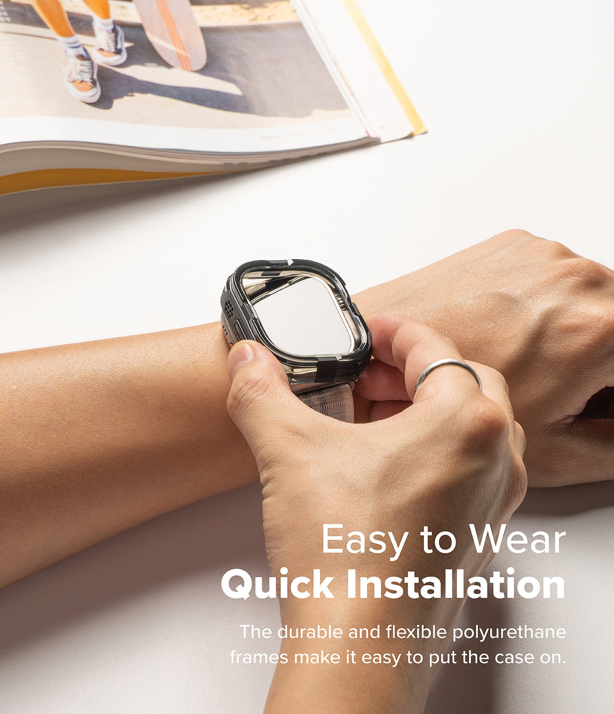 Apple Watch Ultra 3 / 2 / 1 Case | Fusion Bumper - Apple Watch Ultra Fusion Bumper - Hands installing a flexible black protective bumper onto an Apple Watch Ultra.