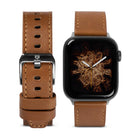 Apple Watch 42·41·40·38 mm | Leather One Classic Band - Brown leather watch band with silver buckle next to Apple Watch.