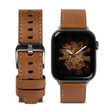 Apple Watch 42·41·40·38 mm | Leather One Classic Band - Brown leather watch band with silver buckle next to Apple Watch.