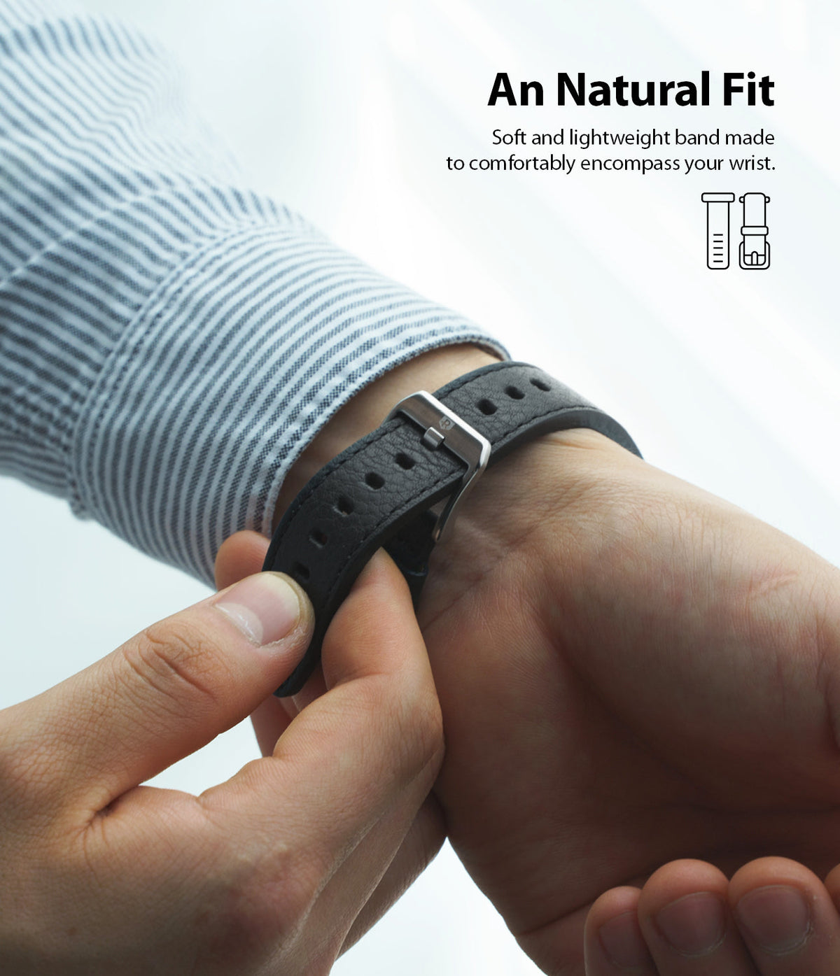 Apple Watch 49·46·45·44·42 mm | Leather One Classic Band - Person fastening a textured black leather watch band.