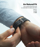Apple Watch 49·46·45·44·42 mm | Leather One Classic Band - Person fastening a textured black leather watch band.