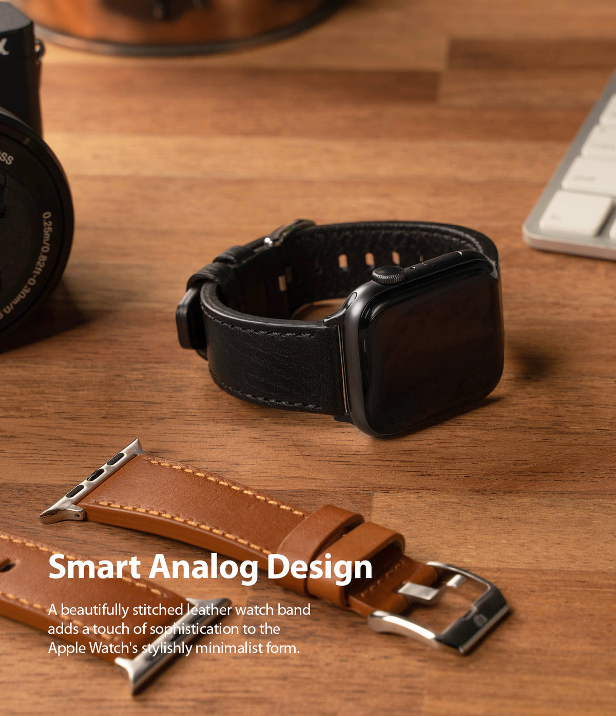 Apple Watch 49·46·45·44·42 mm | Leather One Classic Band - Black Apple Watch with leather band on desk with tan strap.