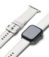 Apple Watch 49·46·45·44·42mm | Leather One Basic - White leather watch band with silver buckle next to a black Apple Watch.