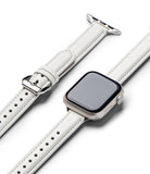 Apple Watch 42·41·40·38 mm | Leather One Padded Slim - A white leather watch strap with silver buckle attached to an Apple Watch.