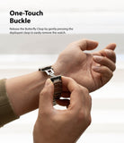 Apple Watch 49·46·45·44·42 mm | Metal One Band - Hands opening the butterfly clasp on a metal watch band.