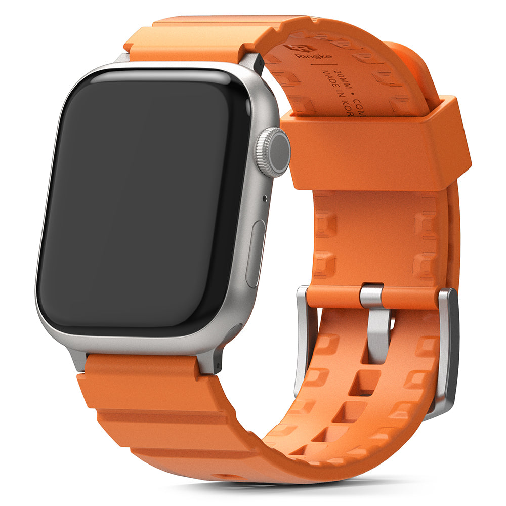 Apple Watch 49·46·45·44·42mm | Rubber One Bold Band - Silver Apple Watch with a bright orange textured rubber strap.