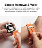 Apple Watch 49·46·45·44·42mm | Rubber One Bold Band - Hands attaching an orange rubber band to an Apple Watch.