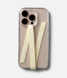Band Strap - A beige smartphone in a clear case with a pale yellow fabric strap attached in a V-shape pattern.