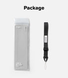 Cam Buckle Hand Strap - A product package and a black wrist strap laid out on a light gray background with the word 'Package' at the top. The package is a clear plastic sleeve containing a light gray rectangular item, and the strap is black with a small white label and metal loop.