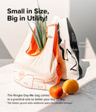 Day-Me Bag - Two reusable tote bags with cute graphics and hidden gussets, holding produce on a marble surface.