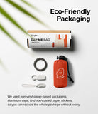 Day-Me Bag - Eco-friendly packaging, a folded red emoticon bag, a carabiner, and clips on a white background.