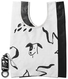 Day-Me Bag - White reusable tote with black hand-drawn dog illustrations and a matching compact storage pouch with keychain.