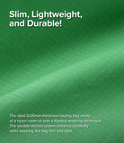 Day-Me Bag - Close-up of green, thin, durable ripstop nylon fabric with text highlighting its lightweight, folding design.