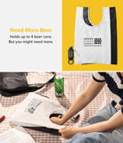 Day-Me Bag - A white reusable tote bag with a beer can graphic, shown folded and in use on a picnic blanket.