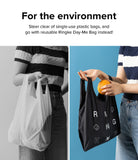 Day-Me Bag - Comparison of a person holding a disposable white plastic bag versus a reusable black Ringke tote bag.