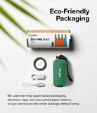 Day-Me Bag - Eco-friendly packaging, a folded green bag, a metal carabiner, and two small clips on a white background.