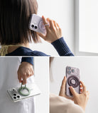 Dual Magnetic Silicone Ring - Color swatches of black, white, light teal, and warm gray on a white background.
