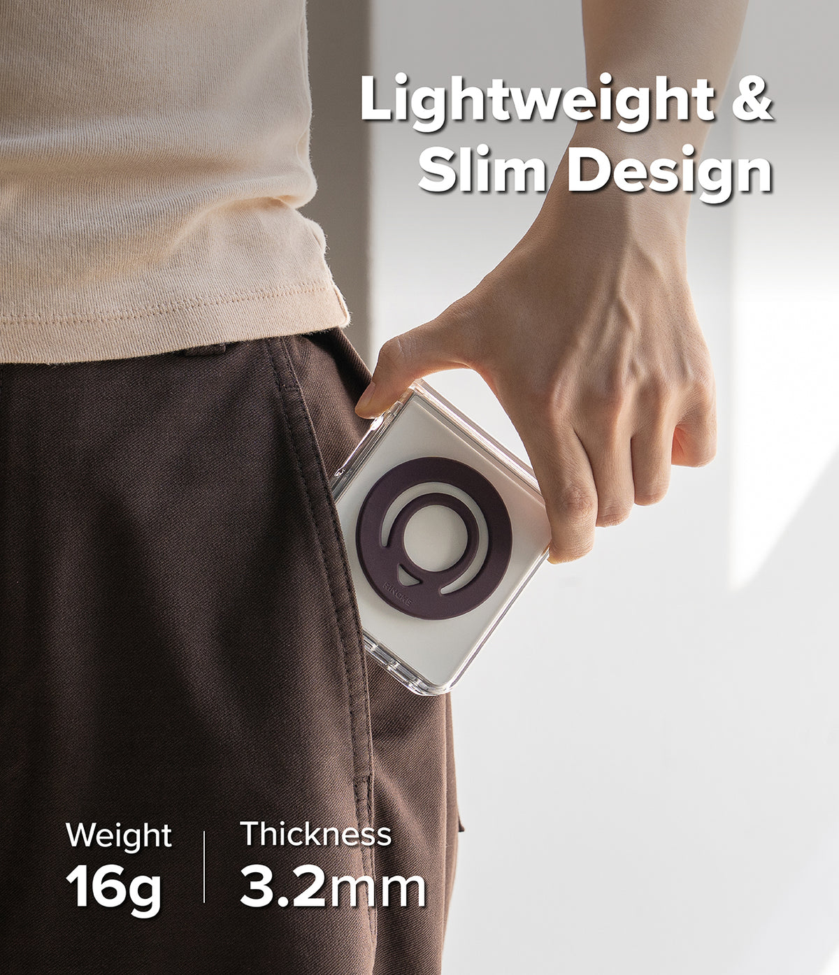 Dual Magnetic Silicone Ring - A person wearing dark brown pants and a light beige t-shirt holds a slim, clear phone case with a dark purple circular magnetic ring. The image features text overlays highlighting the product's lightweight and slim design, weight of 16g, and thickness of 3.