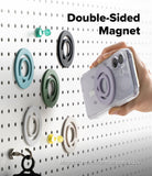 Dual Magnetic Silicone Ring - A hand holds a clear phone case with a lavender double-sided magnetic ring attachment, shown against a white pegboard with several matching magnetic rings in different colors. Text on the image reads 'Double-Sided Magnet' and 'Magnetic attachment on both sides.