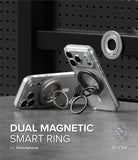 Dual Magnetic Smart Ring - Two smartphones with magnetic ring holders attached, one standing upright on a dark surface.