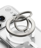 Dual Magnetic Smart Ring - A silver dual-ring magnetic phone grip attached to the back of a clear smartphone case.