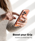 Dual Magnetic Smart Ring - A person holding a smartphone with a silver magnetic ring attached to the back for a secure grip.