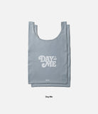 Day-Me Bag - A grey reusable tote bag with white Day-Me logo and small Ringke branding on a light background.