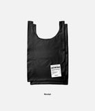 Day-Me Bag - A black reusable tote bag featuring a white receipt-style label with product details on the front.