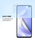 Redmi K30 Screen Protector | Dual Easy Film - A smartphone screen protector being peeled back to reveal dust removal.