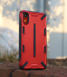 iPhone XR Case | Dual-X [DX] - Rugged red and black protective phone case with geometric accents standing on a brick surface.