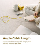 Ringke Fast Charging Pastel Cable - A Type-C Type - Person charging a phone with a long yellow cable while sitting on a rug.