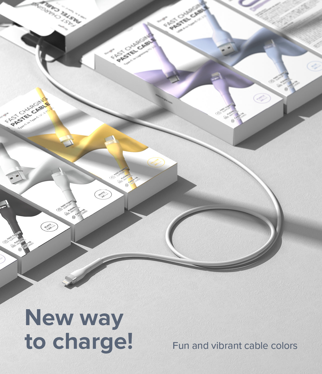 Ringke Fast Charging Pastel Cable - A Type-Lightning - White charging cable coiled next to colorful product boxes.