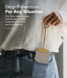 Holder Link Flow Finger Ring - A hand holds a beige finger strap attached to a smartphone case tucked into jeans.