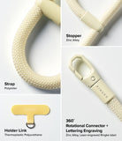 Holder Link Flow Finger Ring - Close-up of cream polyester strap, zinc alloy stopper, holder link, and rotating connector.