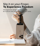 Holder Link Flow Finger Ring - A hand holds a white tumbler while a smartphone hangs securely from a finger via a black strap.
