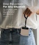 Holder Link Flow Finger Ring - A person holds a smartphone by a black finger strap while it rests in their jeans pocket.