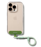 Holder Link Flow Finger Ring - Clear phone case with a green adhesive tab and a detachable light green woven finger strap.