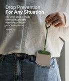Holder Link Flow Finger Ring - A person holding a green finger strap attached to a smartphone case tucked in a jeans pocket.