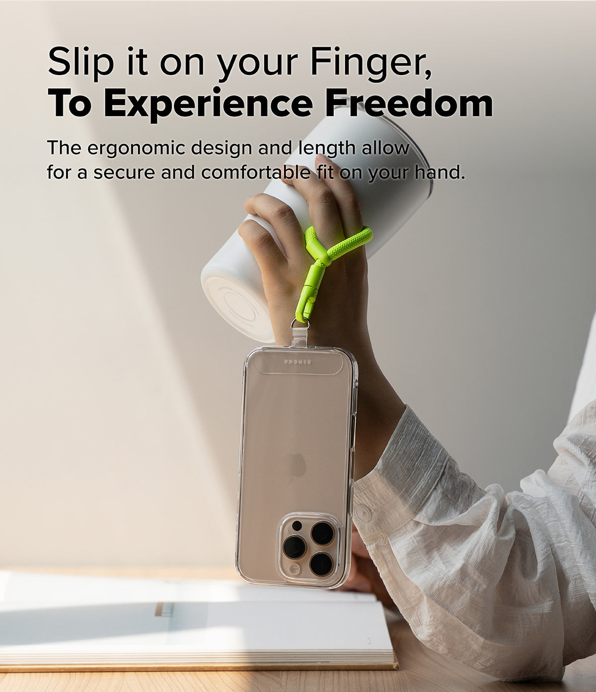 Holder Link Flow Finger Ring - A hand holds a white tumbler with a neon green finger strap attached to a clear phone case.